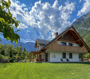 Alpine Luxury Villa with a spacious garden, terrace and mountain views near Lake Bohinj.